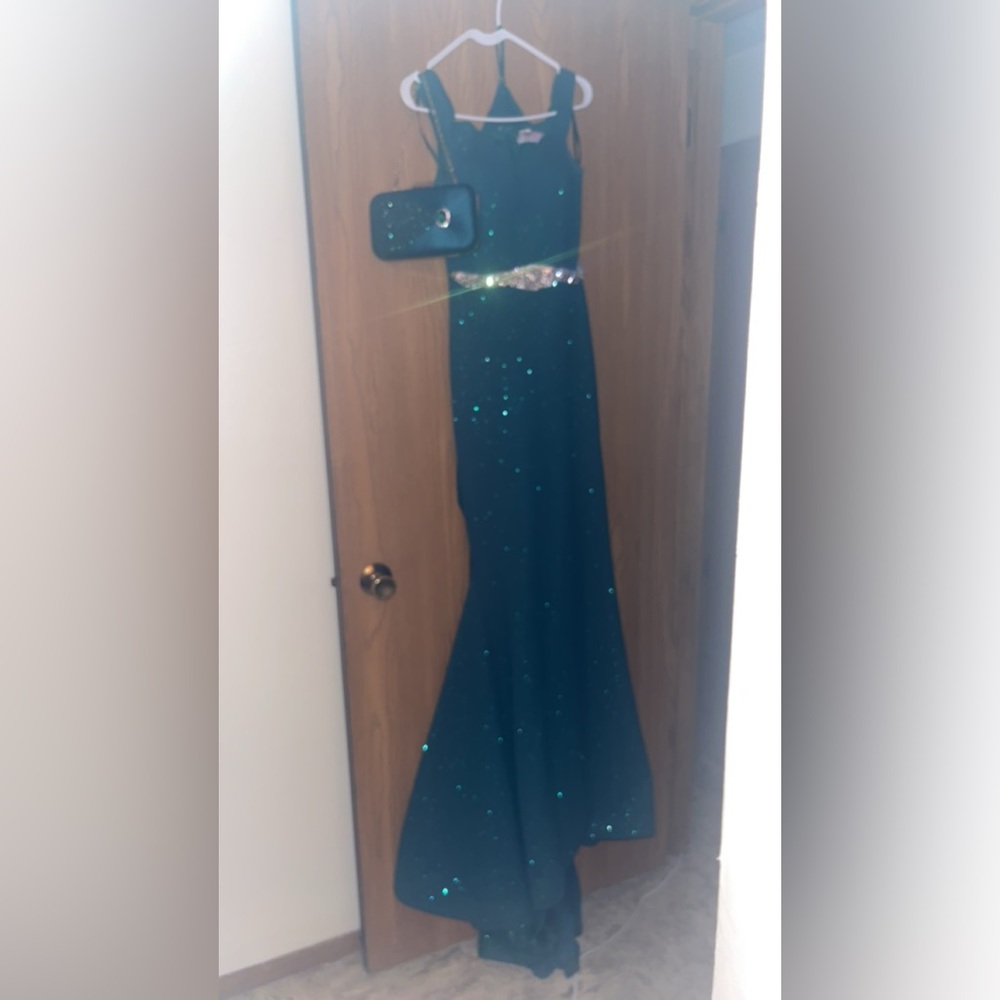 This is an emerald green prom dress size 4